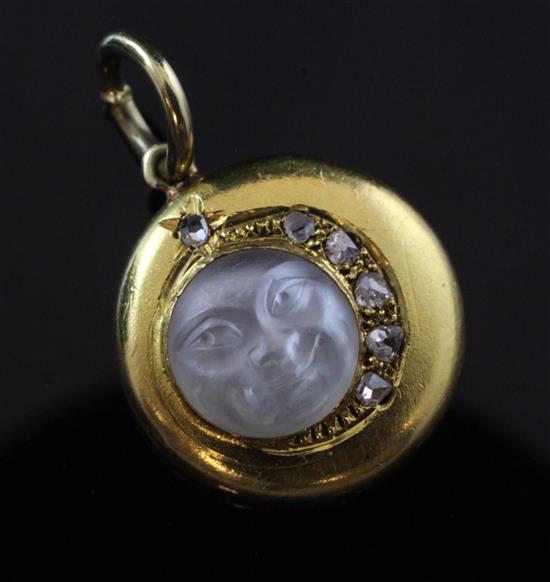 A gold, diamond and frosted glass moon face pendant, 0.5in.